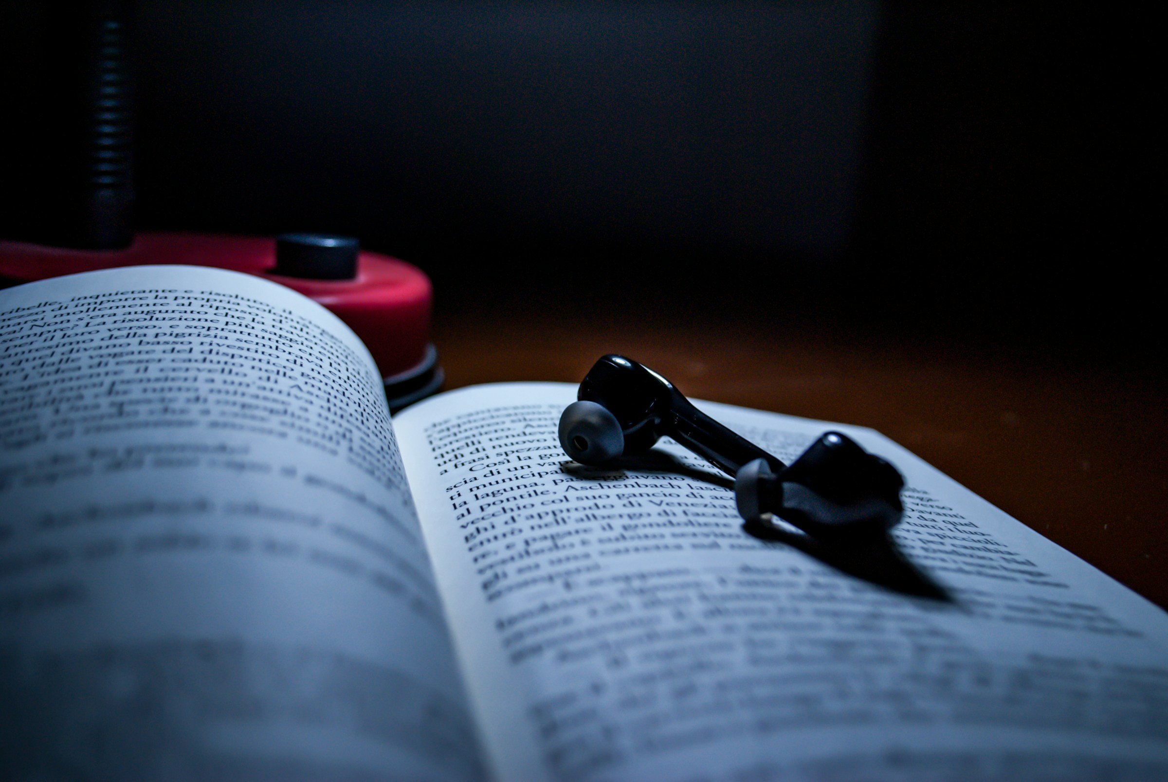 earphones on a book - Text To Speech API