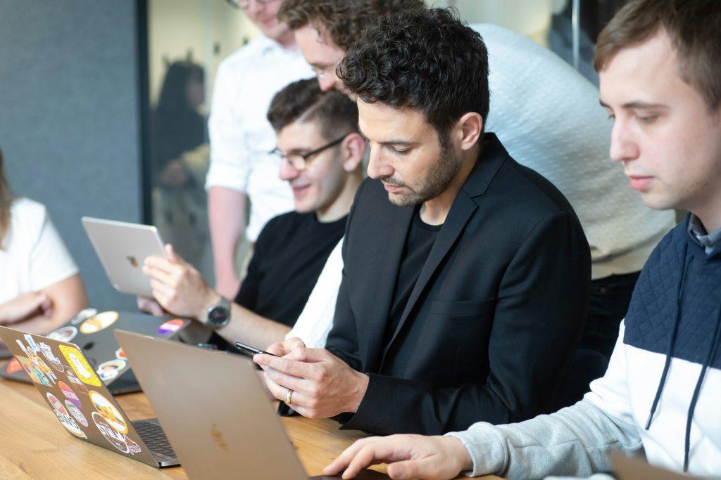 employees on a laptop - Play HT