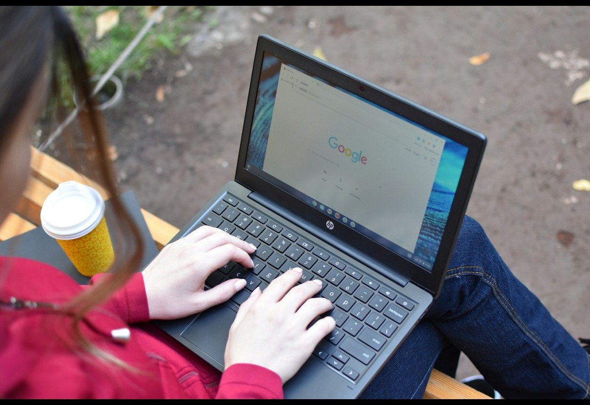 Woman Using Laptop - ElevenLabs Alternatives