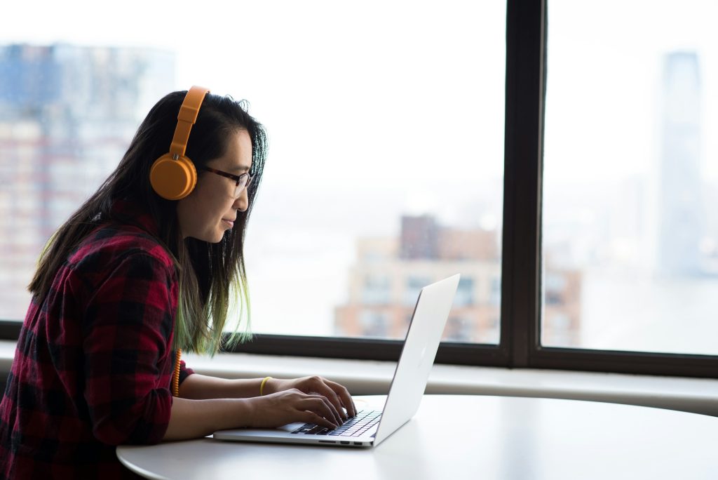 woman wearing yellow headphones - vLLM Continuous Batching