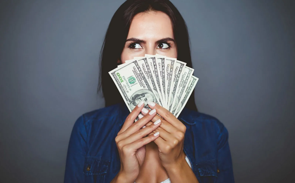 woman holding money - Air AI Pricing 
