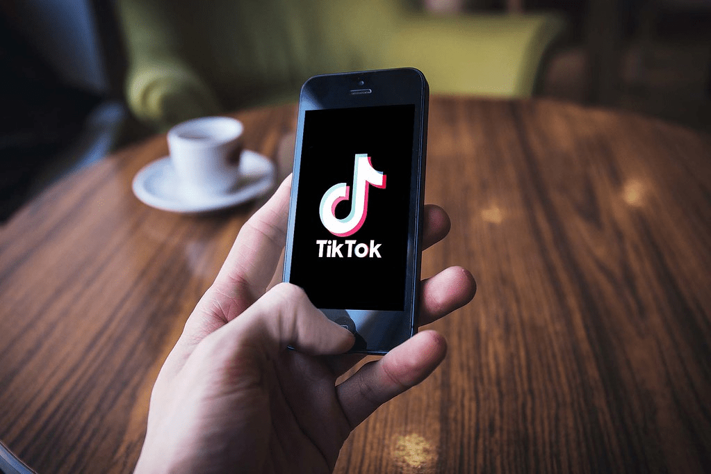 man using tiktok - How to Change Text-to-Speech Voice on TikTok