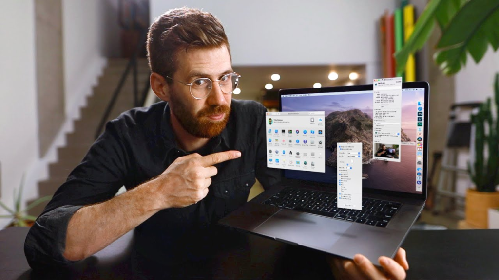 man holding a laptop - How to Text-to-Speech on Mac