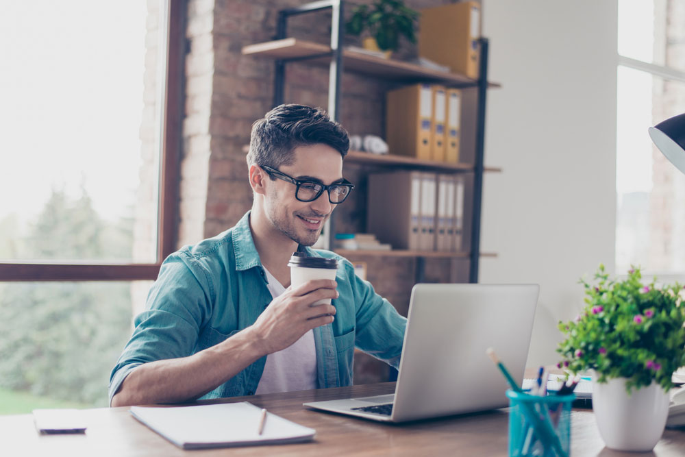 man using a laptop - Does Canva Have Text-to-Speech