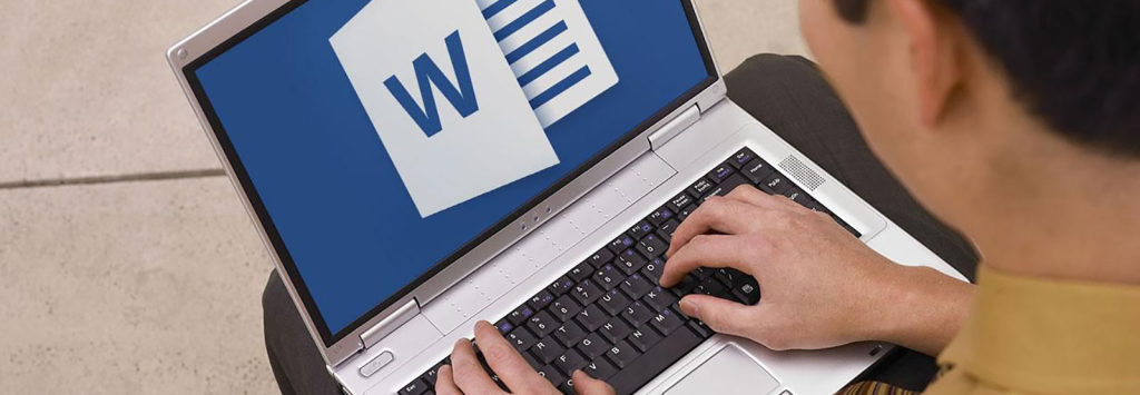 man using a laptop - Does Word Have Text to Speech