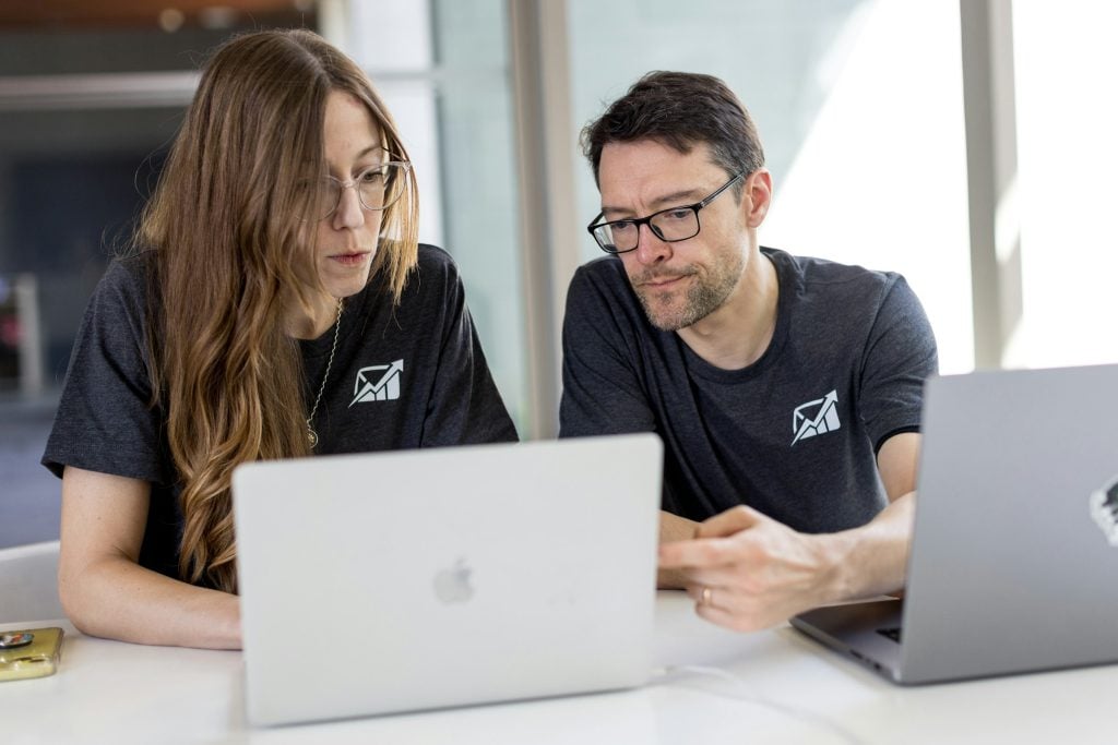 employees working in an office - Conversational AI for Finance