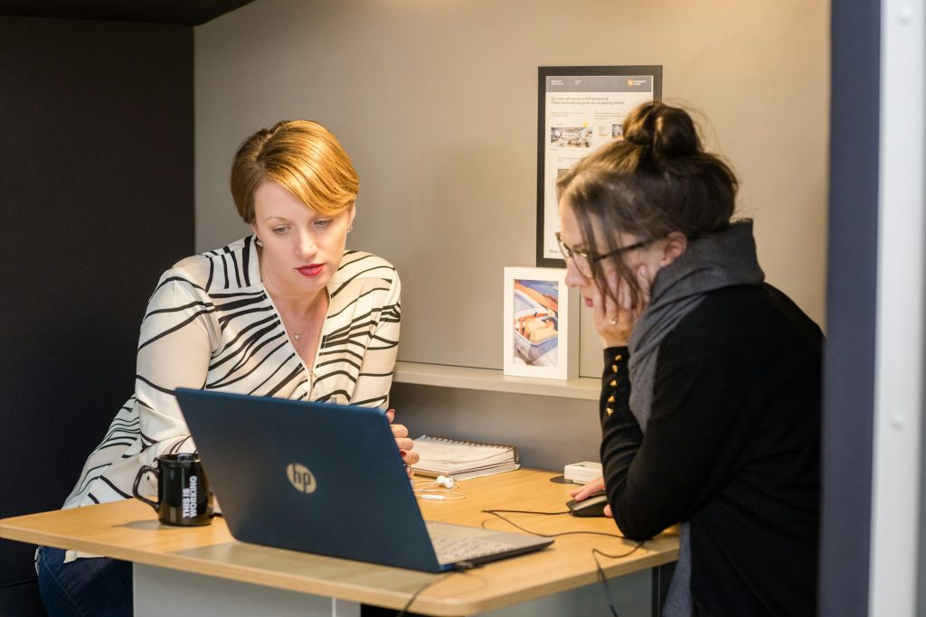 women looking at a laptop - TTSMaker Alternative