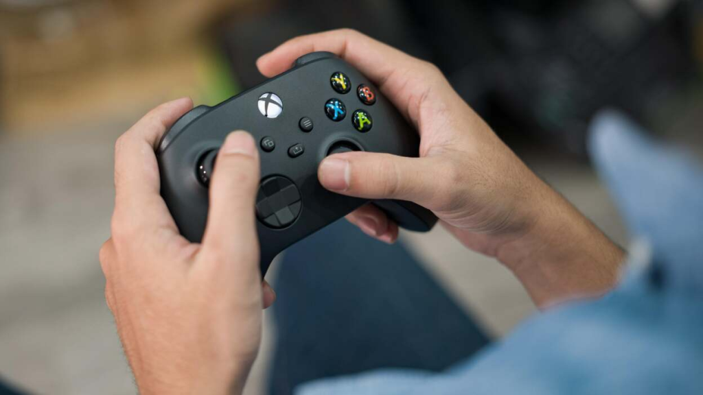 Person Using Xbox Controller - How to Turn On Text to Speech on Xbox