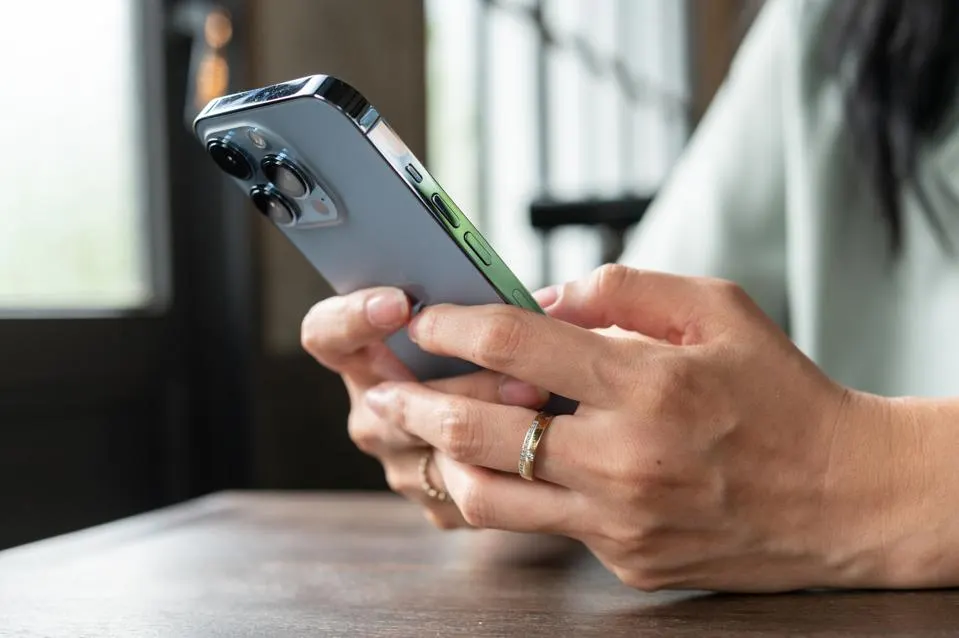 man using an iphone - Best Text-to-Speech App for iPhone