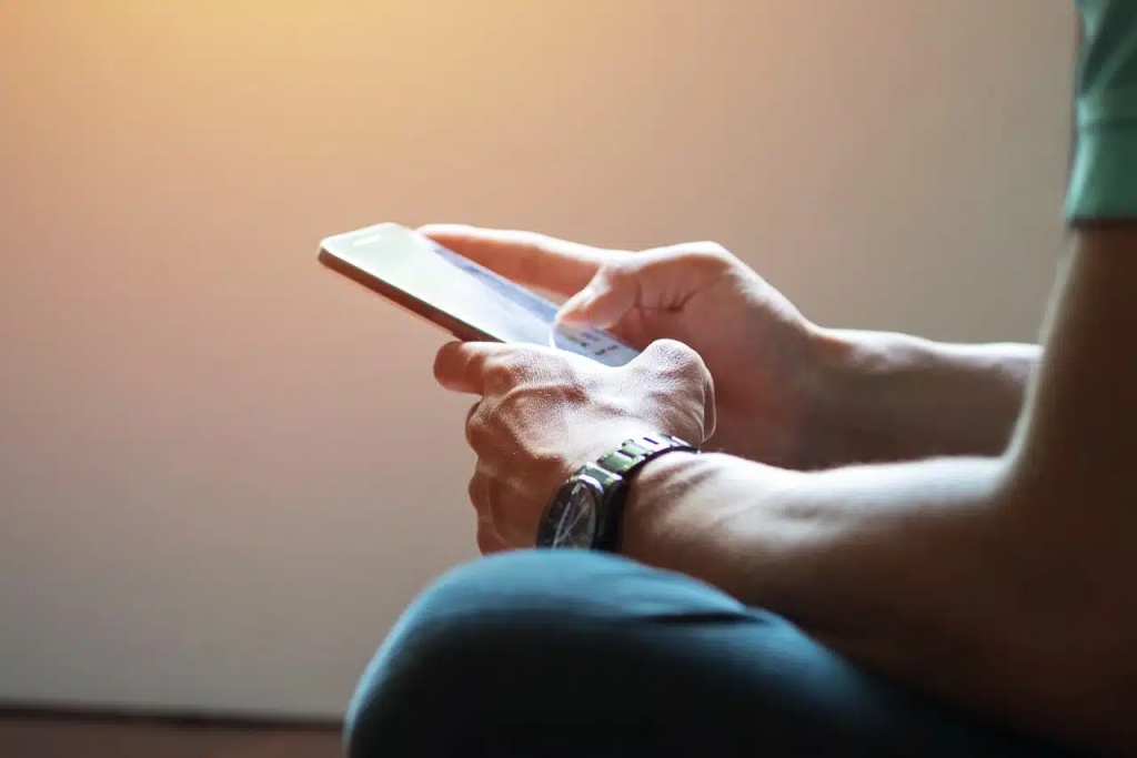 man using his phone - Best Text-to-Speech App for Android