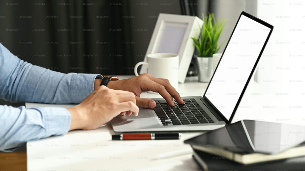 Person Using Laptop - Speechify vs Audible