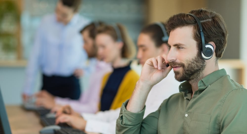 man in a call center - IVR Auto Attendant
