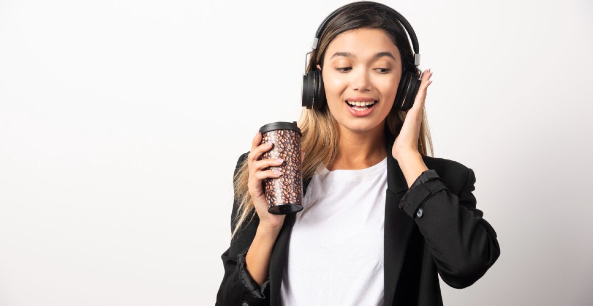 woman using headphones - Uberduck Alternatives
