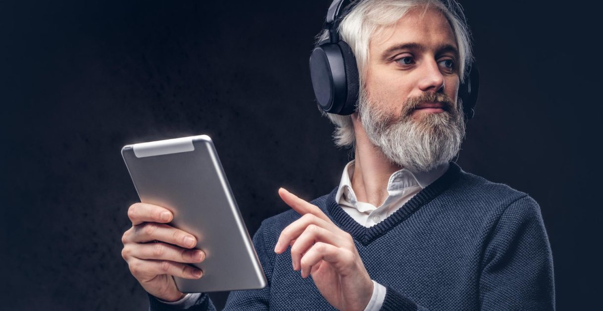 man wearing headphones - Audio AI News
