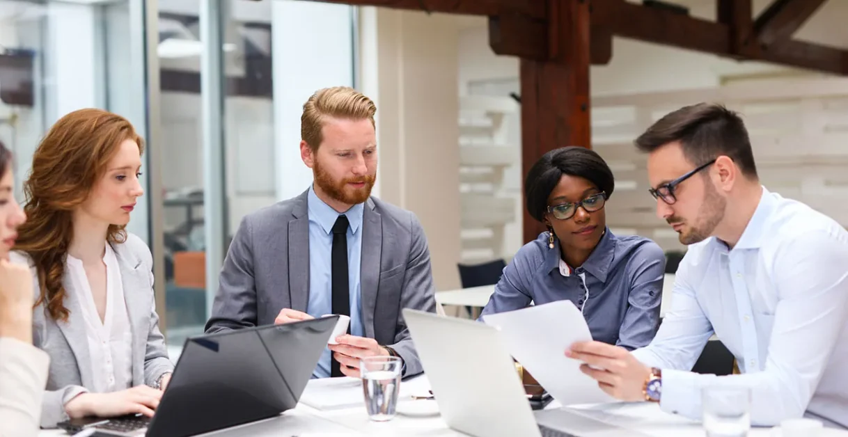 employees talking - Genesys Alternative