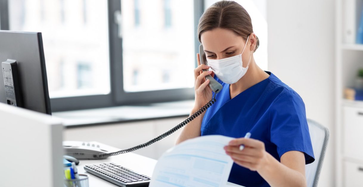 Person using phone - Phone Systems for Healthcare