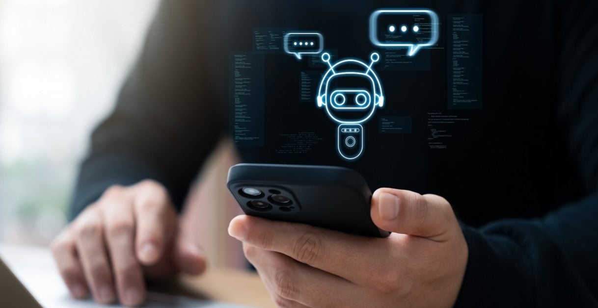 person checking his phone - Twilio AI Chatbot