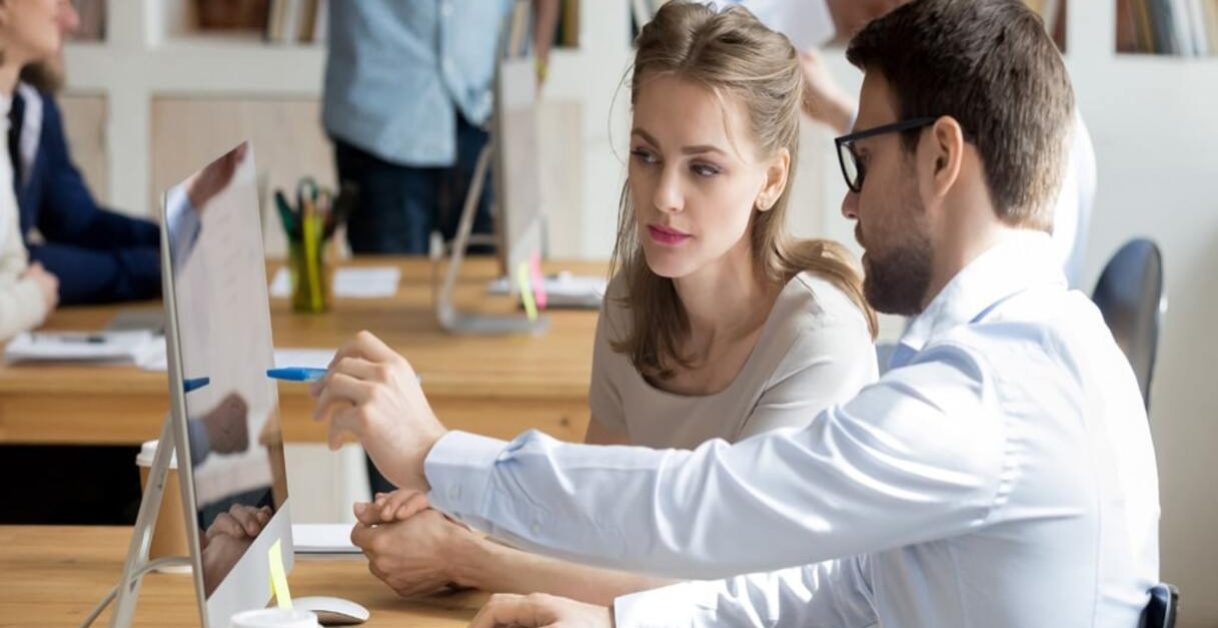 man and woman working - Speech Analytics Use Cases