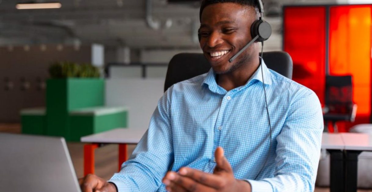 benefits-of-a-customer-service-charter-1024×664 CX agent smiling - Name a Better Upgrade