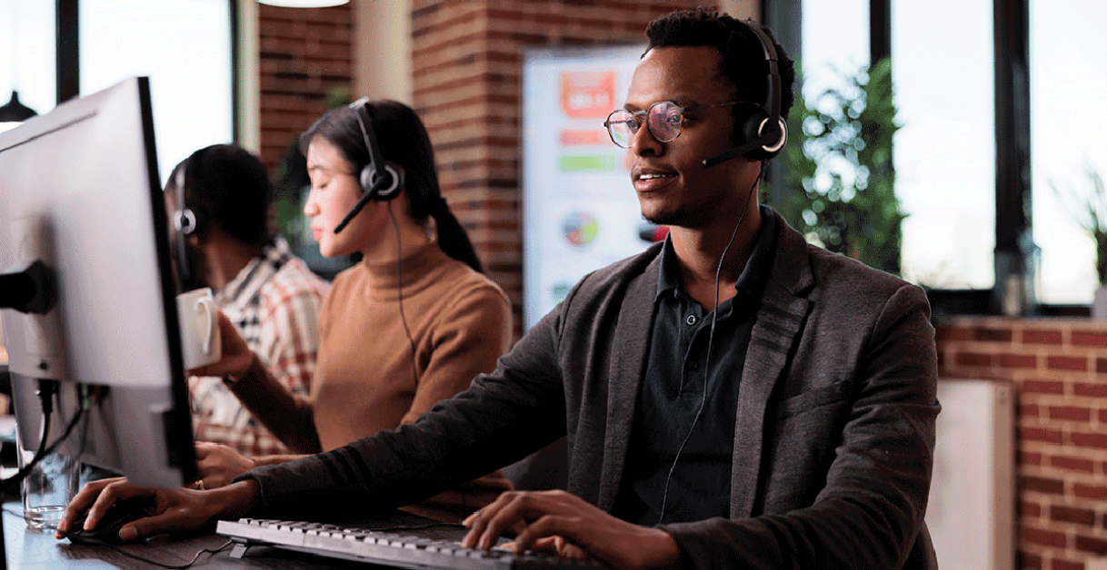 person at call center - How Much Do Answering Services Charge