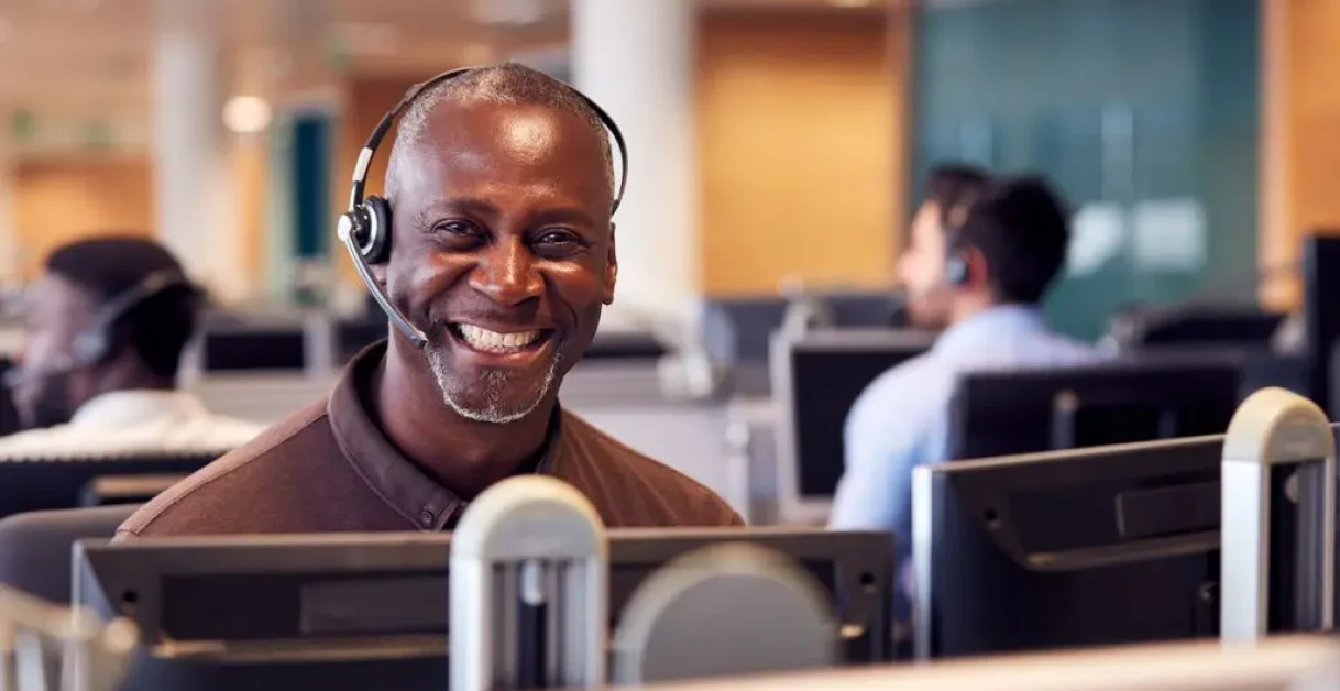 customer service agent smiling - Customer Service Software Examples