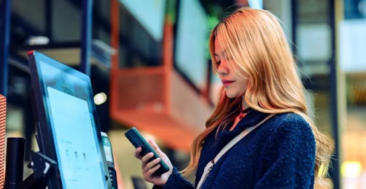 woman using mobile - Conversational AI in Retail
