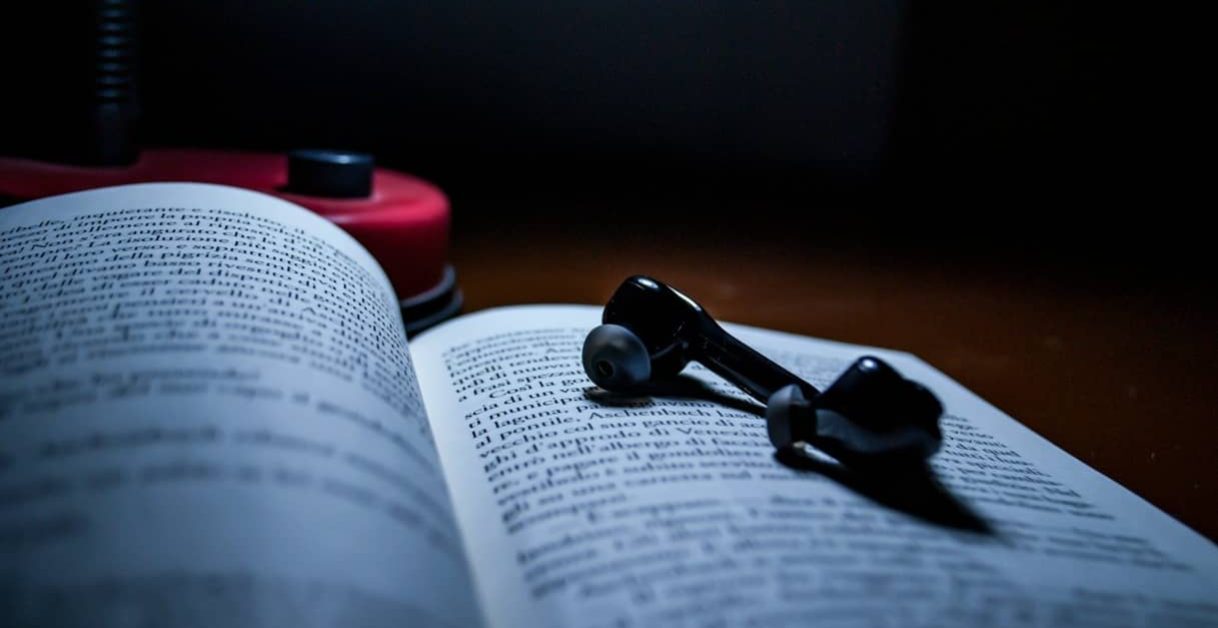 earphones on a book - Text To Speech API
