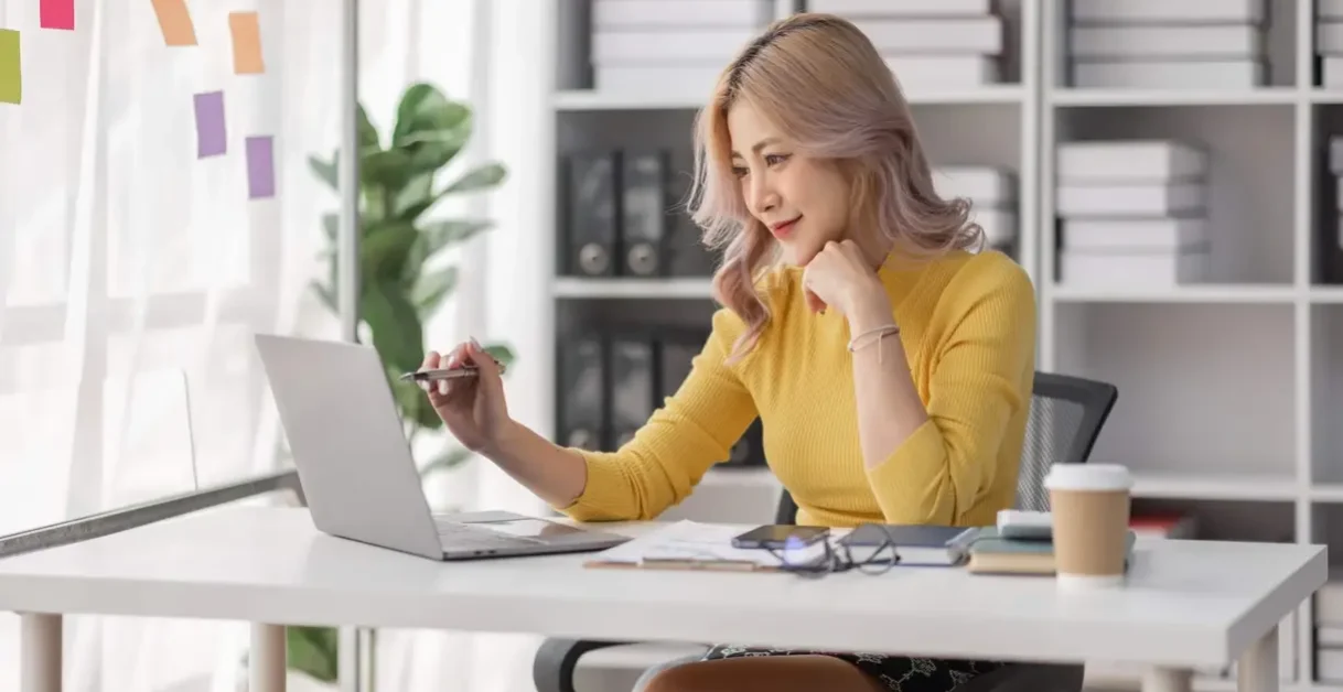Woman Using Laptop - Aircall Alternatives